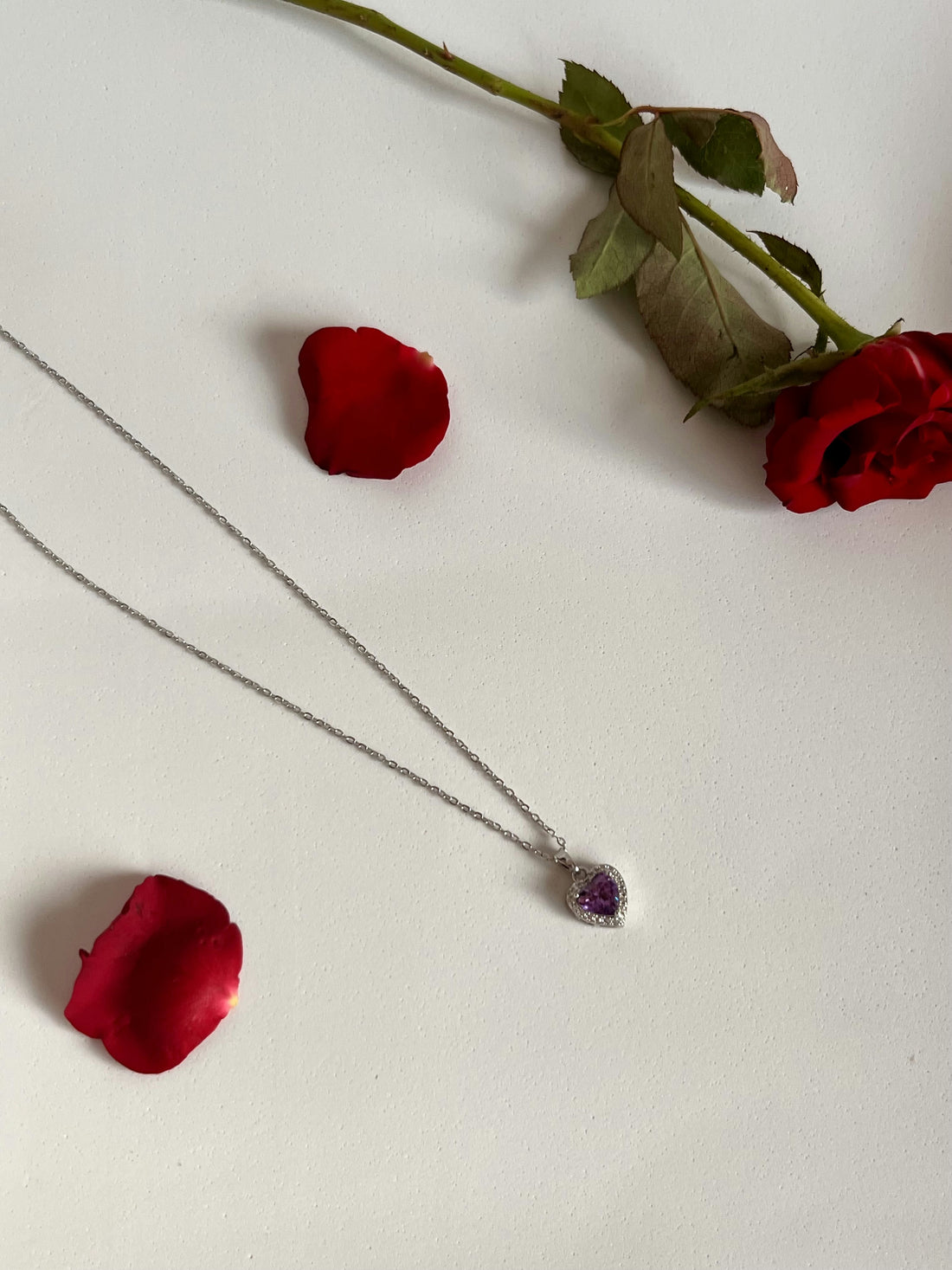 Purple heart pendant with silver studs