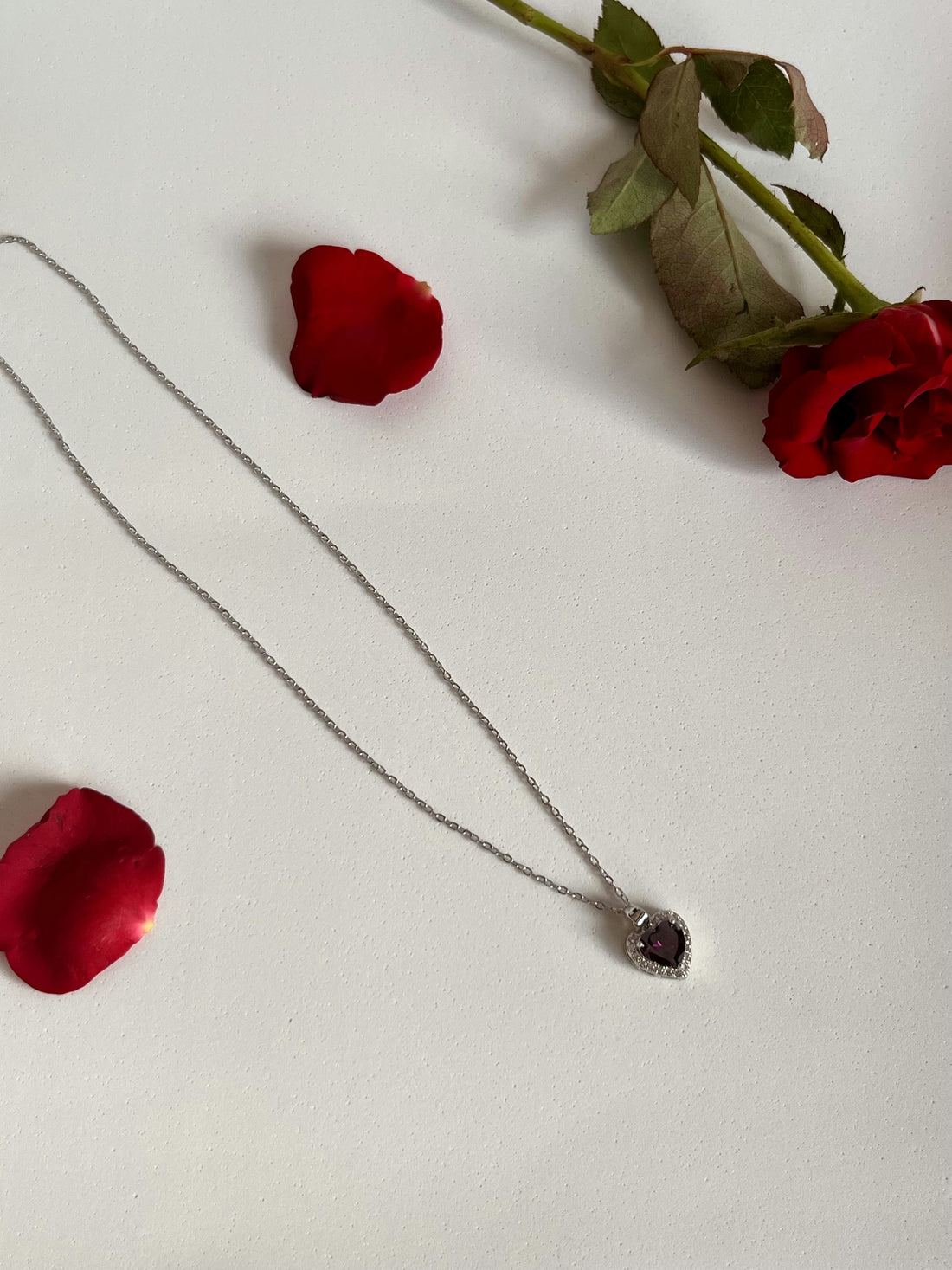 Black heart pendant with silver studs