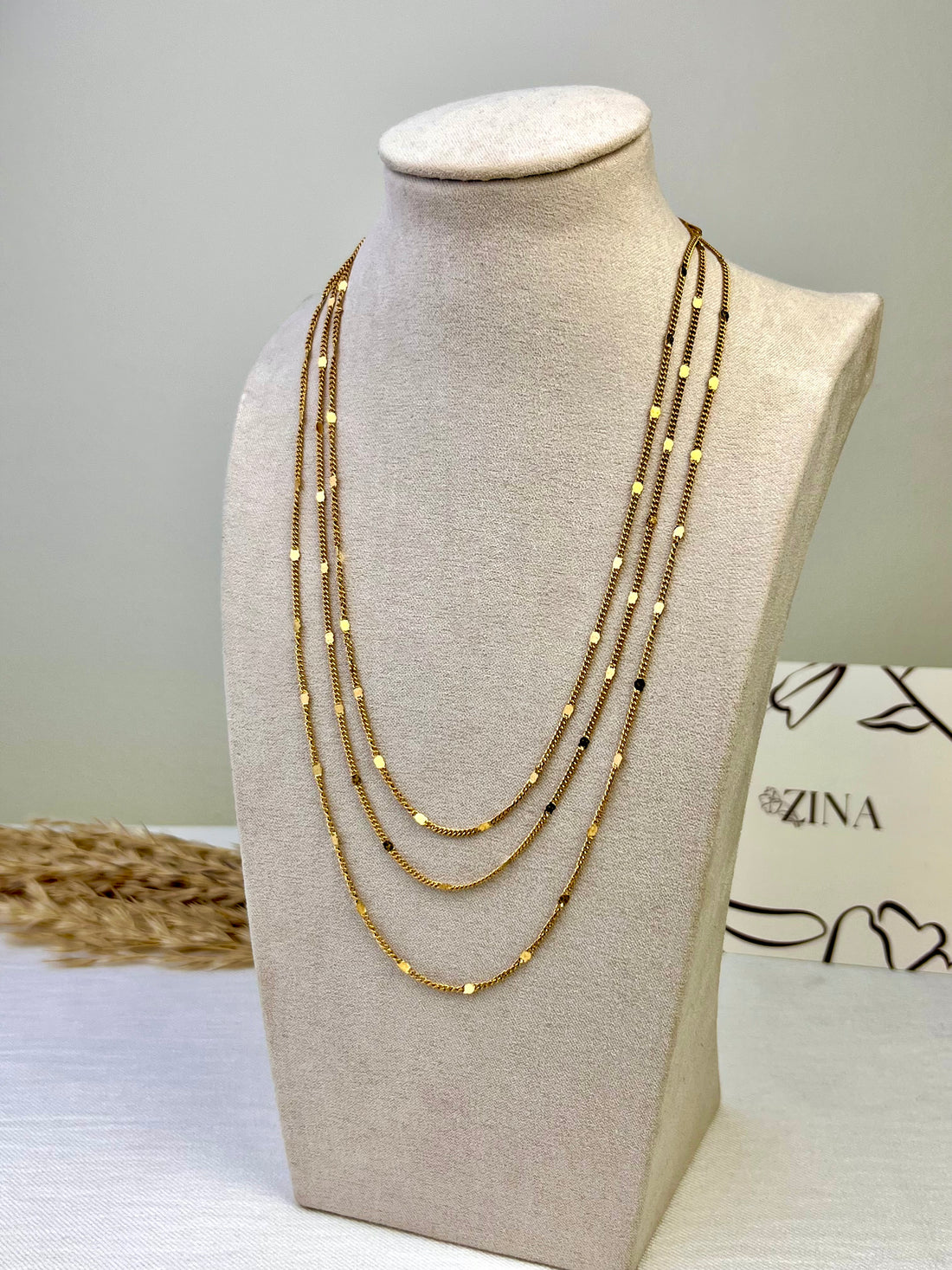 Three-tiered gold necklace
