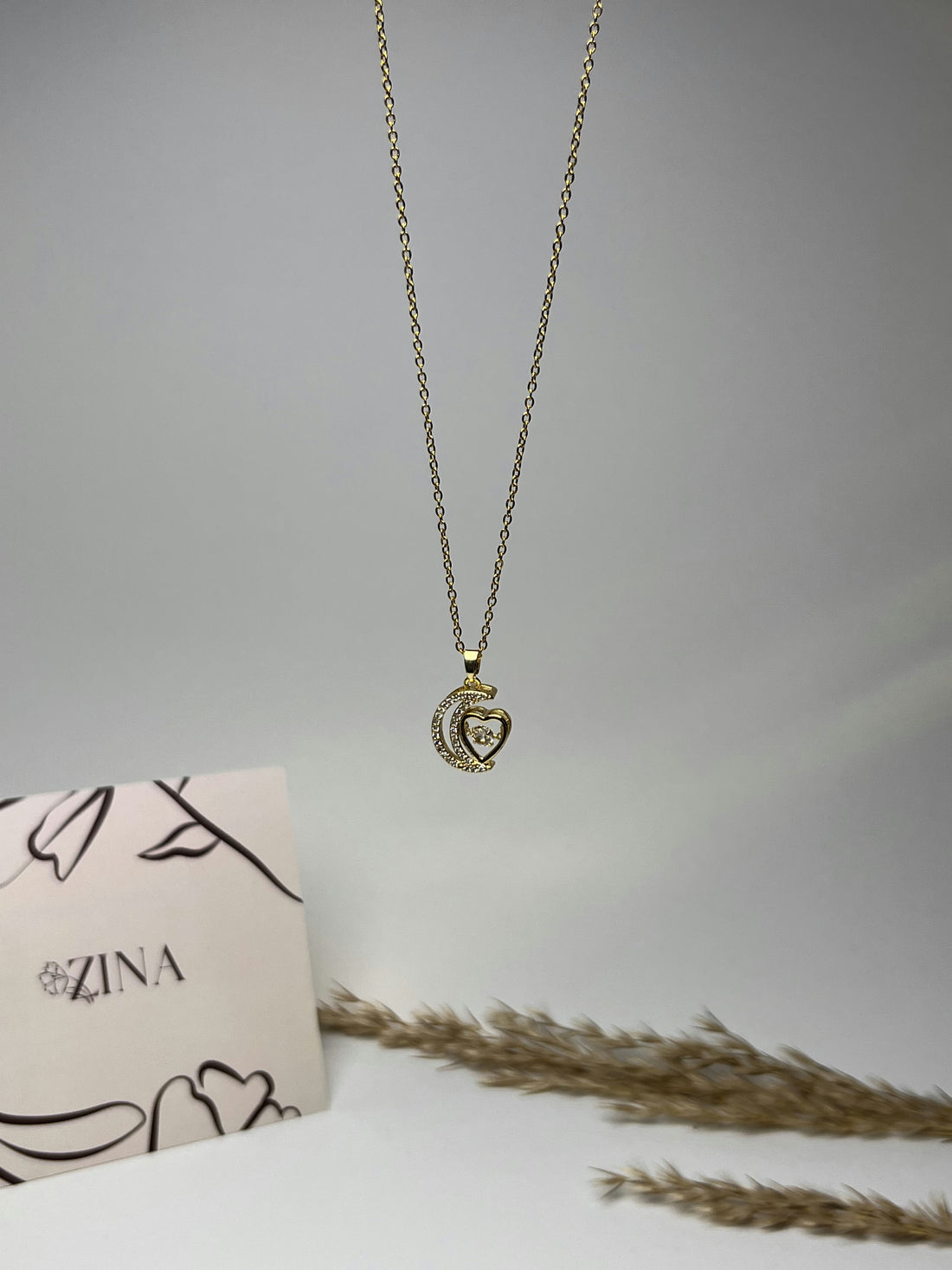 Crescent moon and heart pendant