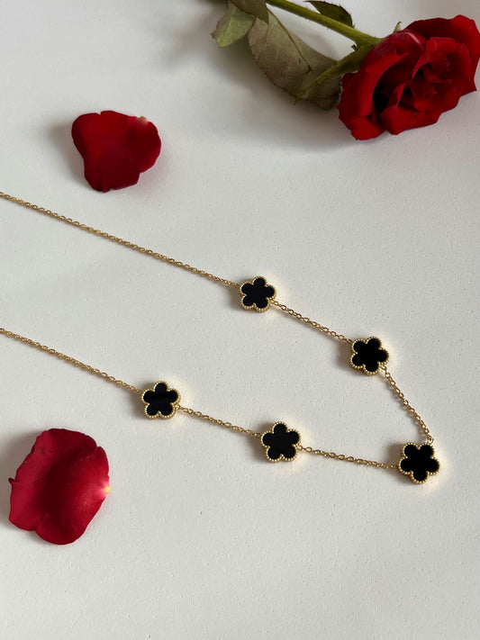 A continuous chain of black flowers