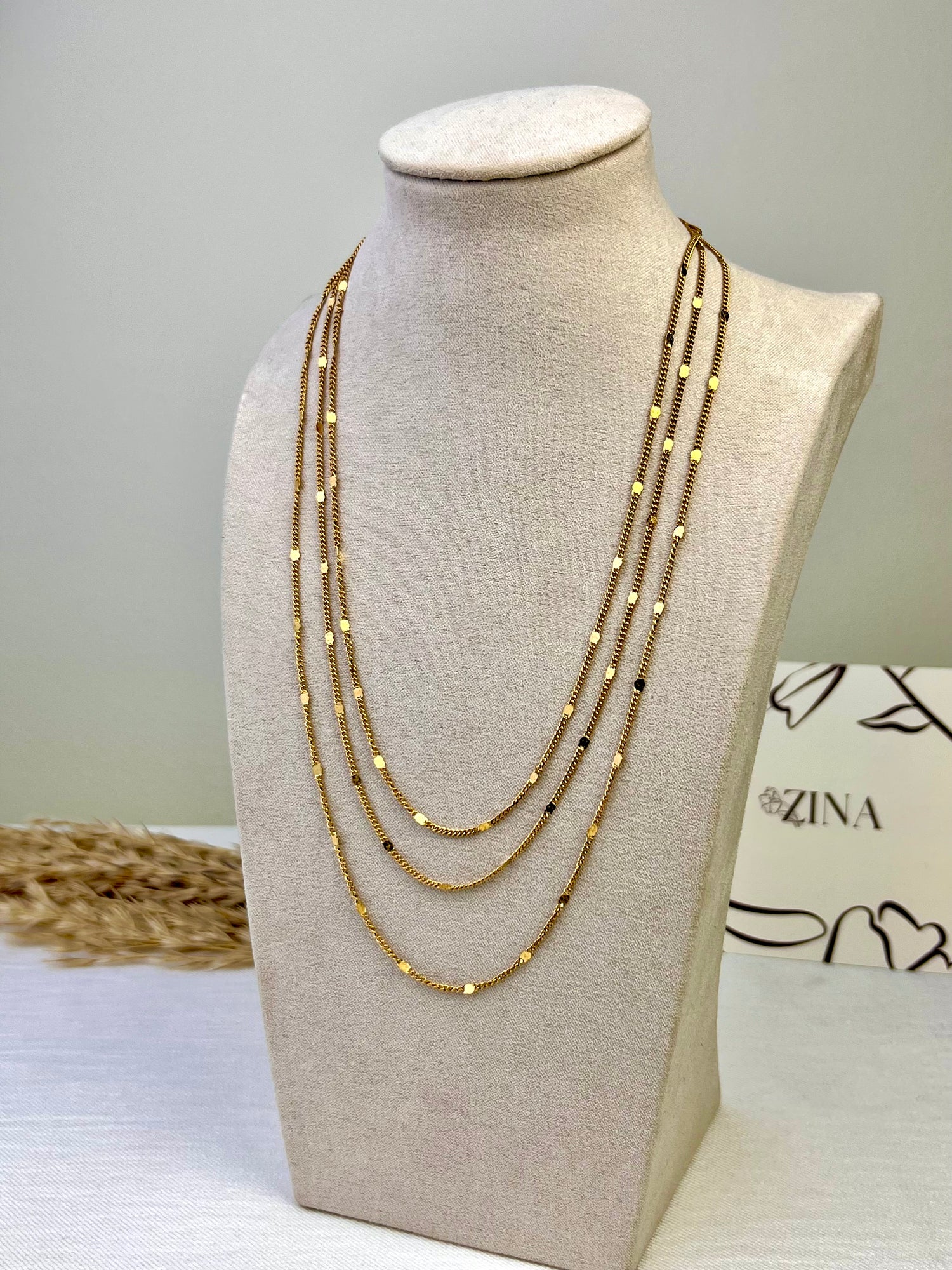Three-tiered gold necklace