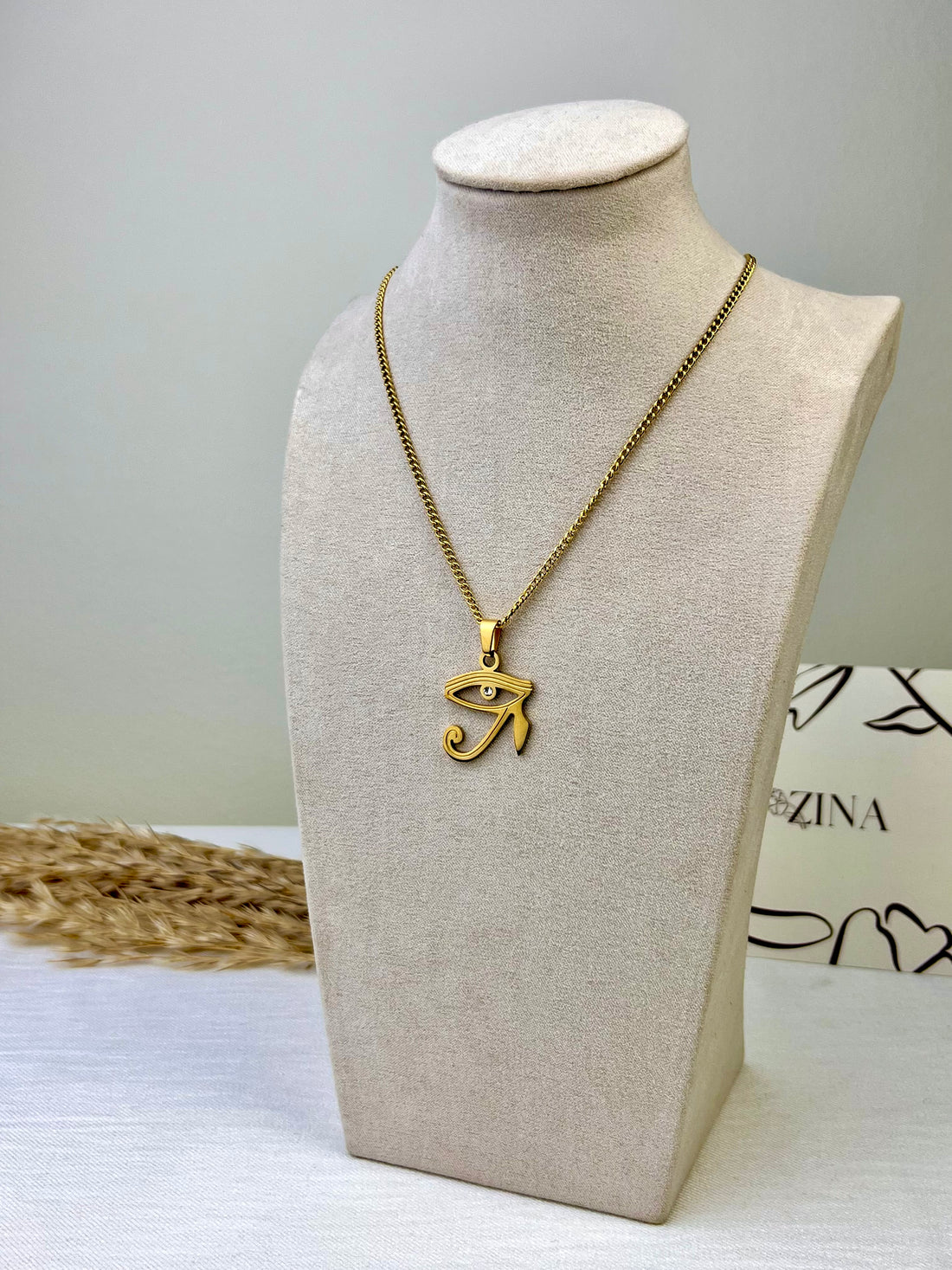 Small Eye of Horus pendant with a sparkling stone