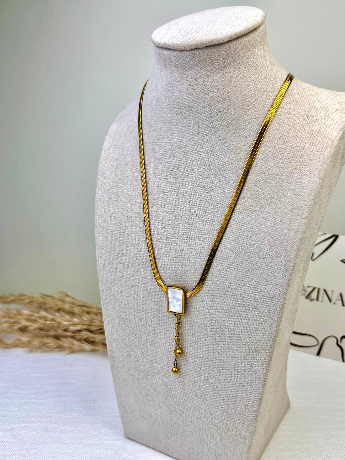 Cobra chain with shell square and tassels