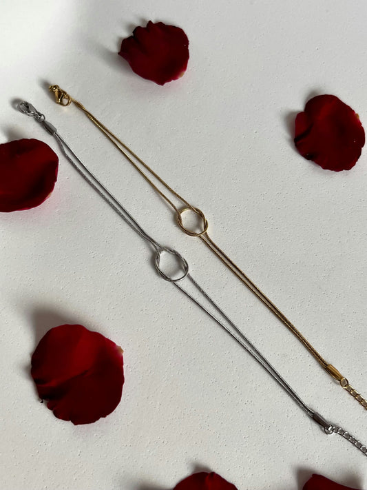 Couple's bracelet with a gold and silver knot
