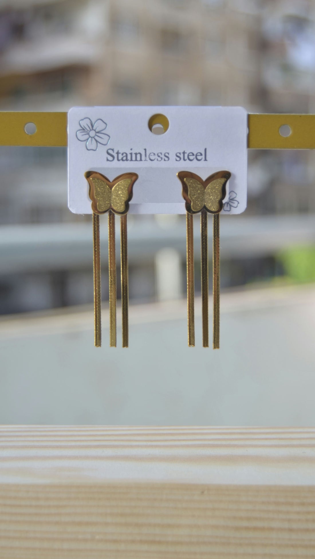 Butterfly earrings and metal tassels